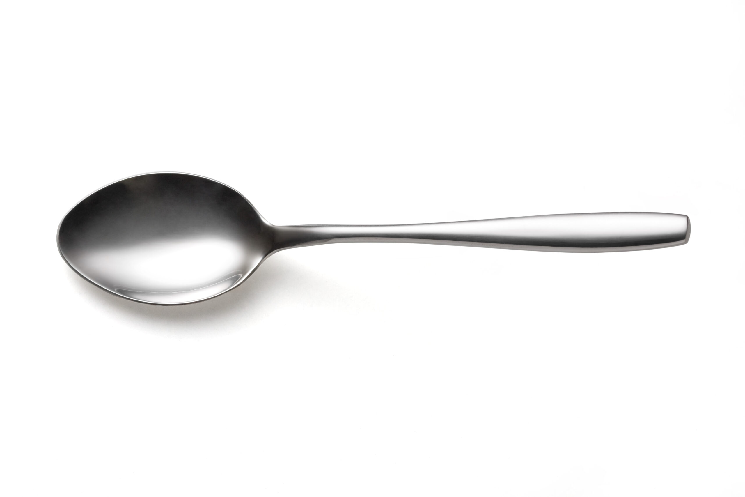 The,Metal,Shiny,Spoon,On,White,Background